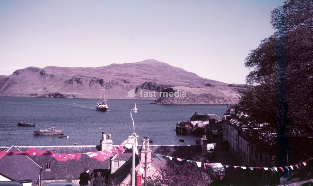 The Cuillins from Portree, Isle of Skye, Scotland, c1955. The Cuillin is a range of mostly jagged rocky mountains. The main Cuillin ridge, a national scenic area, is also called the Black Cuillin
