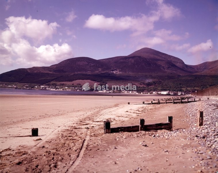 Mountains of Mourne, Newcastle, County Down, Northern Ireland, c1955. The Mourne Mountains are a predominantly granite mountain range in the south-east of Northern Ireland. They include the highest mountain in all of Ulster, Slieve Donard at 850 metres (2,790 feet). The Mournes are designated an…
