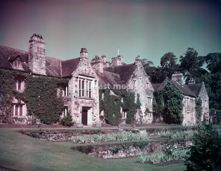 Cotehele Cornwall, c1955. Cotehele, in Calstock, is a medieval granite and slate-stone manor house with Tudor additions. It was built by the Edgecumbe family in 1485 after the original Manor House was pulled down. There are a number of formal gardens and a richly planted area in the valley;…