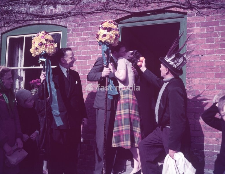 Tutti Men claiming a kiss, Hocktide Festival, Hungerford, Berkshire, c1955. Hocktide or Tutti Day is an ancient annual tradition held on the second Tuesday after Easter. The event is associated with the town's great patron, John of Gaunt. Its origins are thought to lie in celebrations following…