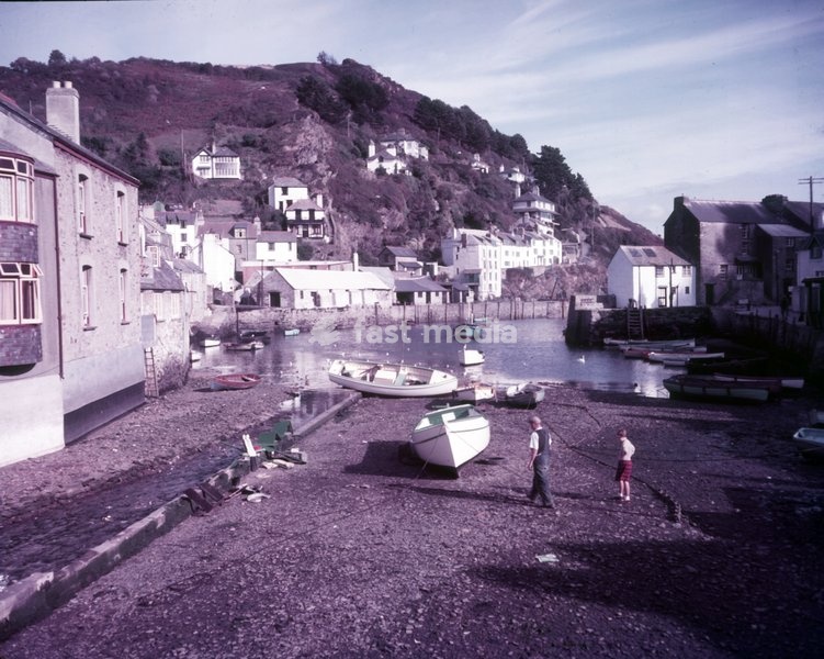 Polperro, Cornwall, c1955. The fishing village of Polperro is a noted tourist destination, particularly in the summer months, for its idyllic appearance with tightly-packed ancient fishermen's houses which survive almost untouched, its quaint harbour and attractive coastline