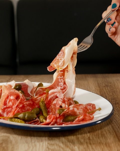 Antipasti with fennel salami, proscuitto, pickles at ALFI in Spitalfields, London, United Kingdom