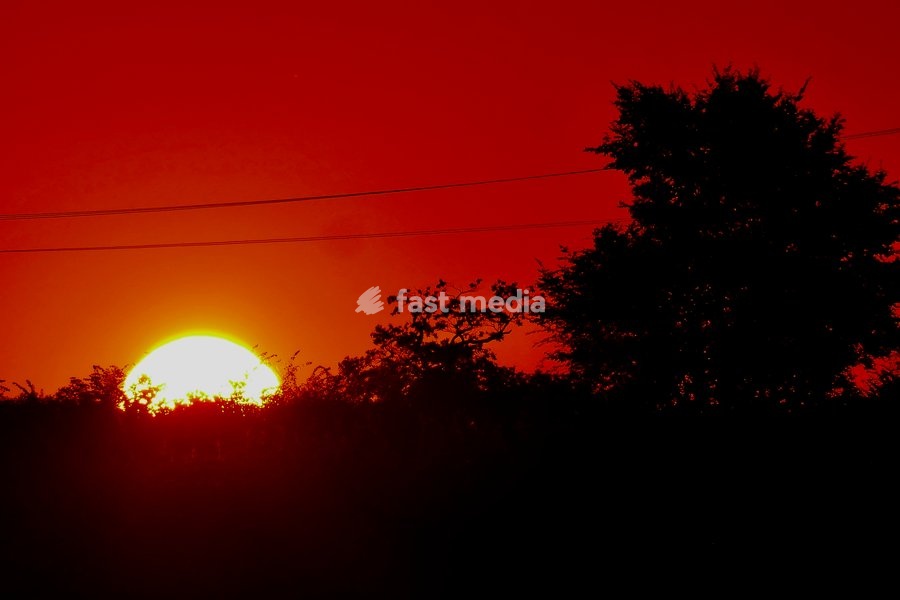 The days sun rises over the countryside