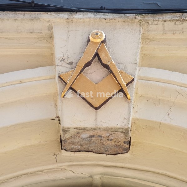 Masonic compass and square above doorway in central Exeter. Exeter, Devon . United Kingdom. 22 July 2026