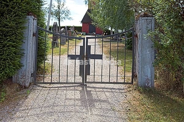Old wrought iron entrance gate with cross to cemetery, Salo, Finland