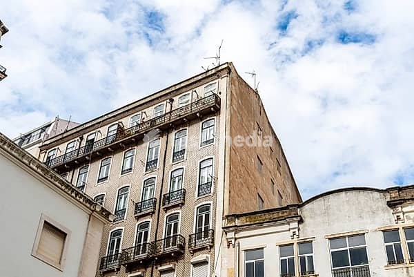A view of historic buildings in the Alfama quarter of Lisbon, Portugal, showcasing traditional architecture and street details