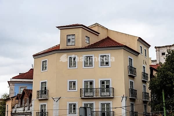 A view of historic buildings in the Alfama quarter of Lisbon, Portugal, showcasing traditional architecture and street details