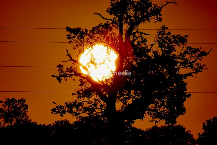 The days sun rises over the countryside