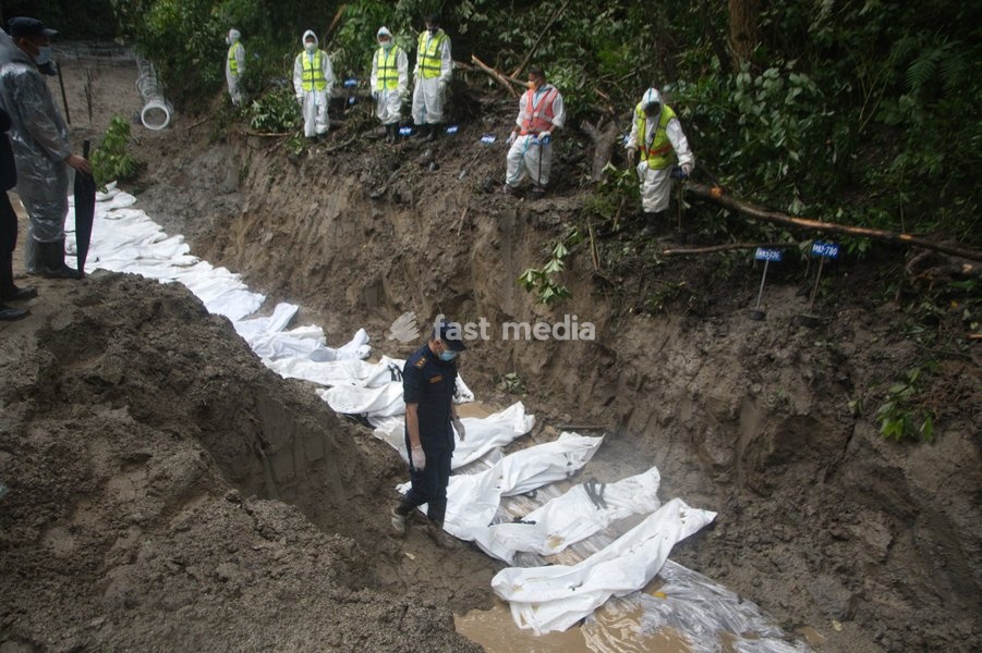 Nepalese Army personnel carry out preparations for the burial of unidentified flash flood victims at a site in Kathmandu, Nepal, Tuesday, Sept. 1, 2026. Security forces have been deployed to manage final rites as recovery efforts continue across flood-affected regions