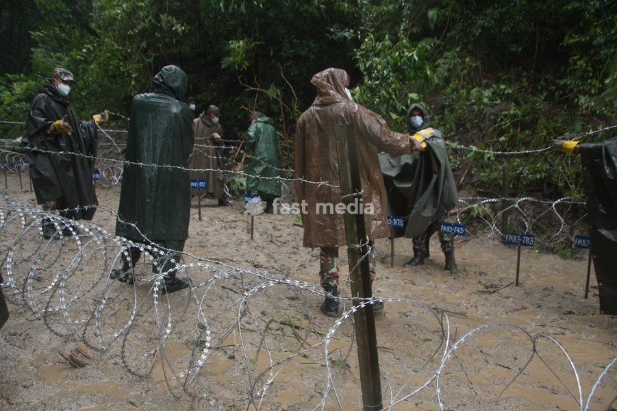 Soldiers of the Nepalese Army coordinate logistics and ground work at a temporary burial ground in Kathmandu, Nepal, Tuesday, Sept. 1, 2026, following catastrophic flooding that claimed hundreds of lives along the Himalayan border area