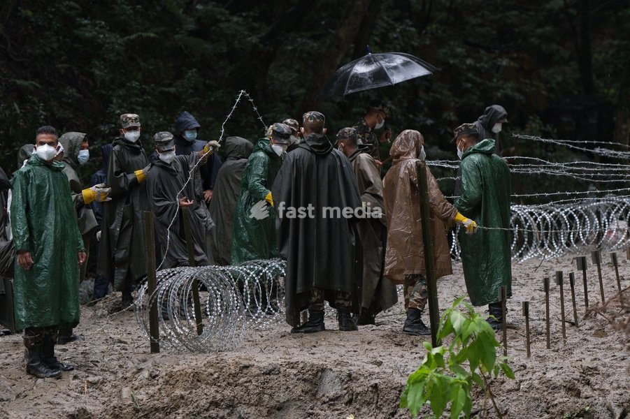 Soldiers of the Nepalese Army coordinate logistics and ground work at a temporary burial ground in Kathmandu, Nepal, Tuesday, Sept. 1, 2026, following catastrophic flooding that claimed hundreds of lives along the Himalayan border area