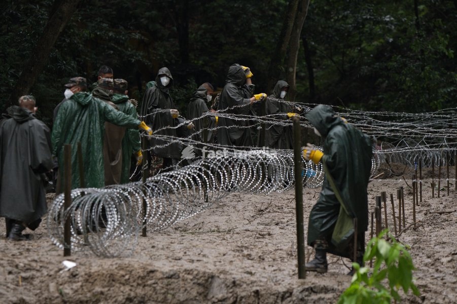 Soldiers of the Nepalese Army coordinate logistics and ground work at a temporary burial ground in Kathmandu, Nepal, Tuesday, Sept. 1, 2026, following catastrophic flooding that claimed hundreds of lives along the Himalayan border area