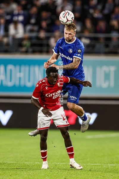 Standard's Salieu Drammeh and Gent's Siebe Van der Heyden fight for the ball during a soccer match between KAA Gent and Standard de Liege, Friday 18 September 2026 in Gent, on day 7 of the 2026-2027 'Jupiler Pro League' first division of the Belgian championship