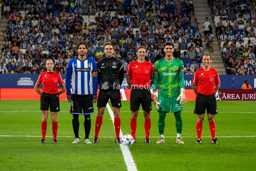 Referees pose for a photo with team captains prior to the LaLiga EA Sports matchday 7 football match between RCD Espanyol and Elche CF at Stage Front Stadium on September 18, 2026 in Cornellà de Llobregat, Spain