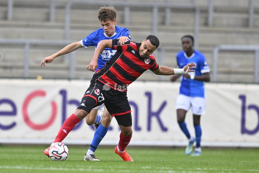 Jong Genk's August De Wannemacker and Seraing's Amine Messoussa fight for the ball during a soccer match between Jong Genk (U21) and RFC Seraing, Saturday 19 September 2026 in Genk, on day 6 of the 2026-2027 'Challenger Pro League' 1B second division of the Belgian championship