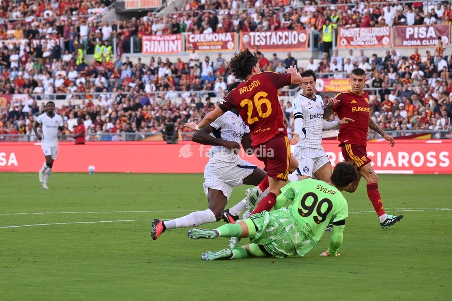 Yann Aurel Bisseck of Inter under pressure from Mile Svilar of Roma during the match of Serie A Enilive Football Match between Roma vs Inter at the Olimpico Stadium on 19 September 2026 in Rome, Lazio, Italy. Roma vs Inter 2-2