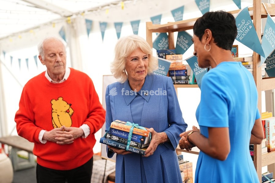 Queen Camilla with Gyles Brandreth speaking to author Reeta Chakrabarti, whose book, Finding Belle, has the list for The Queen's Reading Room Book Club Autumn 2026 season, during The Queen's Reading Room Festival at Chatsworth House, Bakewell. Picture date: Saturday September 19, 2026