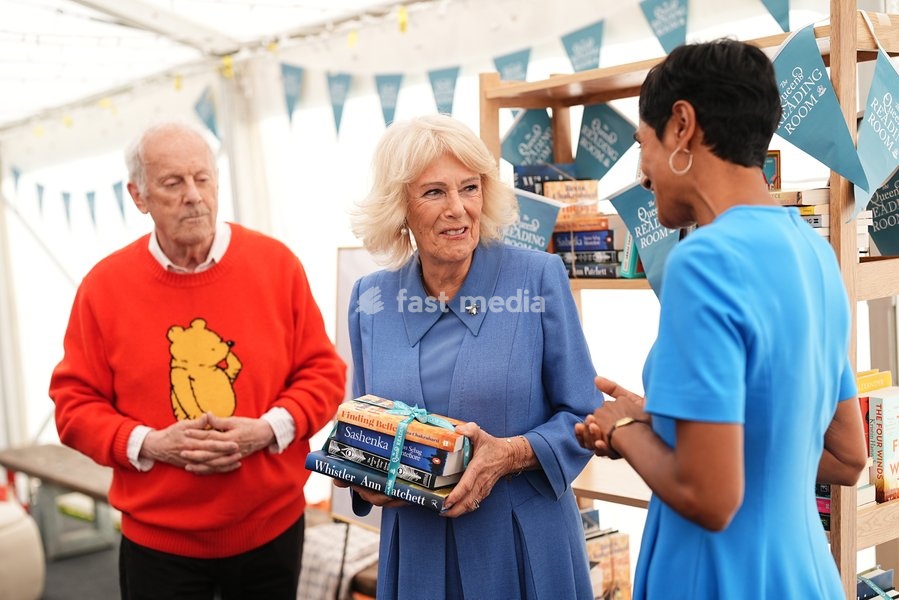 Queen Camilla with Gyles Brandreth speaking to author Reeta Chakrabarti, whose book, Finding Belle, has the list for The Queen's Reading Room Book Club Autumn 2026 season, during The Queen's Reading Room Festival at Chatsworth House, Bakewell. Picture date: Saturday September 19, 2026