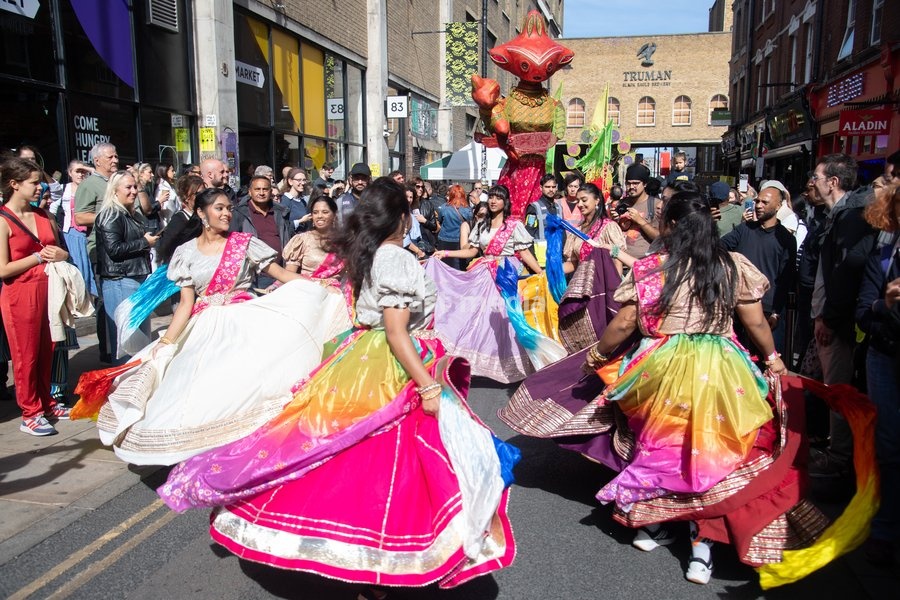 Performers take part in a parade as part of the Annual Brick lane Festival 2026 in Brick Lane, London, England, UK on Sunday 20 September, 2026