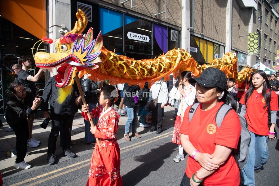 Performers take part in a parade as part of the Annual Brick lane Festival 2026 in Brick Lane, London, England, UK on Sunday 20 September, 2026