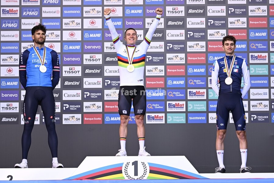 L-R, silver medalist, Italy's Filippo Ganna; winner world champion Belgium's Remco Evenepoel and bronze medalist France's Paul Seixas celebrate on the podium of the men's elite individual time trial race (39,2km) at the cycling UCI Road World Championship, in Montreal, Canada, Sunday 20 September…