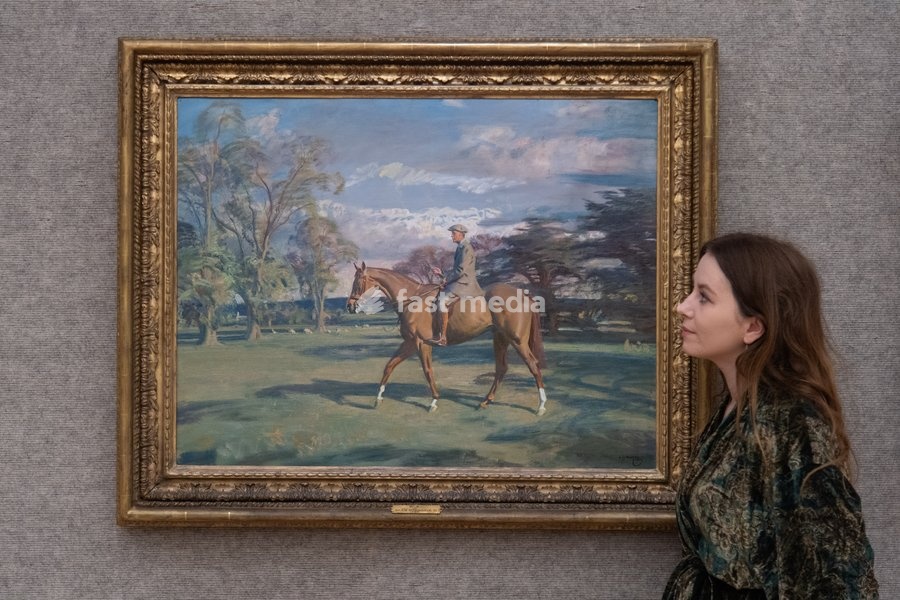 A staff member views 'Portrait of Waldorf Astor, 2nd Viscount Astor on Bill's Simondale II' by Sir Alfred James Munnings (est. £200k - £300k) which is to go on auction at Bonhams' 19th Century and British Impressionist Art Sale on 23rd September 2026 at Bonhams in London, England, UK on Monday 21…