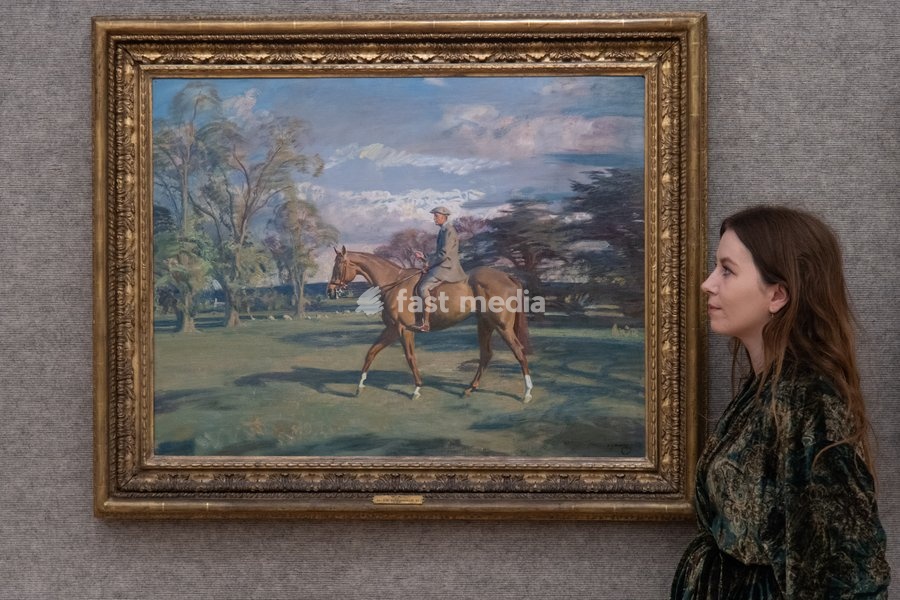 A staff member views 'Portrait of Waldorf Astor, 2nd Viscount Astor on Bill's Simondale II' by Sir Alfred James Munnings (est. £200k - £300k) which is to go on auction at Bonhams' 19th Century and British Impressionist Art Sale on 23rd September 2026 at Bonhams in London, England, UK on Monday 21…