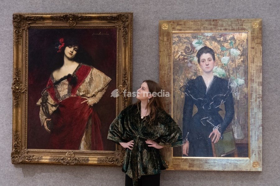 A staff member views (L) - 'Titianella' by Juana Romani (est. £10k - £15k) and (R) - 'Dame aux lilas' by Edgar Maxence (est. £30k - £50k) which is to go on auction at Bonhams' 19th Century and British Impressionist Art Sale on 23rd September 2026 at Bonhams in London, England, UK on Monday 21…