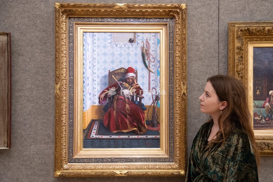 A staff member views 'Portrait of Markos Botsaris' by Fabio Fabbi (est. £30k - £50k) which is to go on auction at Bonhams' 19th Century and British Impressionist Art Sale on 23rd September 2026 at Bonhams in London, England, UK on Monday 21 September, 2026