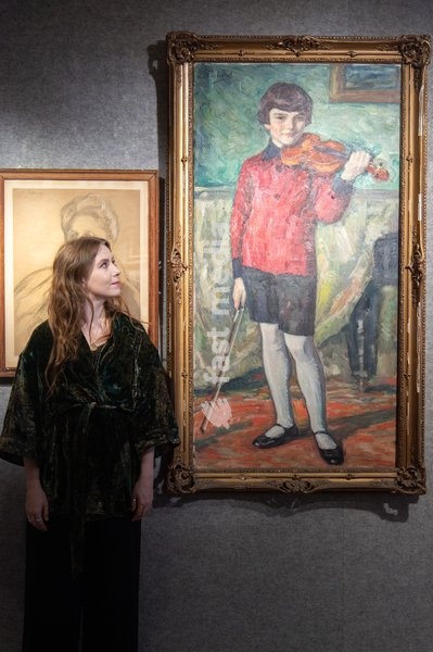 A staff member views 'Portrait of Walter Lob with violin' by Leonid Osipovich Pasternak (est. £40k - £60k) which is to go on auction at Bonhams' 19th Century and British Impressionist Art Sale on 23rd September 2026 at Bonhams in London, England, UK on Monday 21 September, 2026