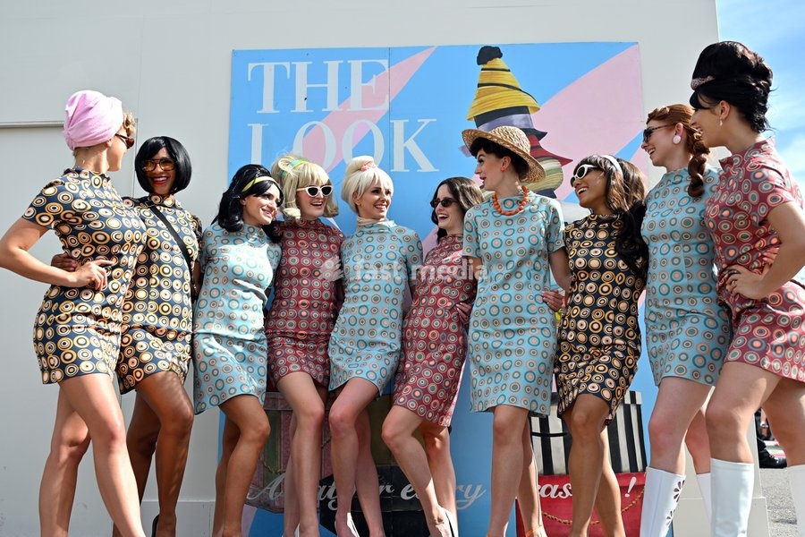Racegoers in vintage fashion on day three of Goodwood Revival presented by Dunlop at the Goodwood Motor Circuit in Chichester, West Sussex. Picture date: Sunday September 20, 2026. This year's Revival is bringing La Dolce Vita to life with a track parade of over 300 Vespas and vintage scooters, a…