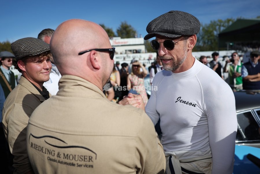 Jenson Button being interviewed during the National Anthem ceremony on day three of Goodwood Revival presented by Dunlop at the Goodwood Motor Circuit in Chichester, West Sussex. Picture date: Sunday September 20, 2026. This year's Revival is bringing La Dolce Vita to life with a track parade of…
