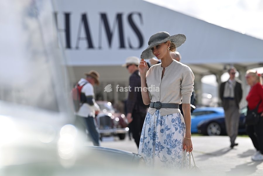 Racegoer dressed in vintage fashion on day three of Goodwood Revival presented by Dunlop at the Goodwood Motor Circuit in Chichester, West Sussex. Picture date: Sunday September 20, 2026. This year's Revival is bringing La Dolce Vita to life with a track parade of over 300 Vespas and vintage…