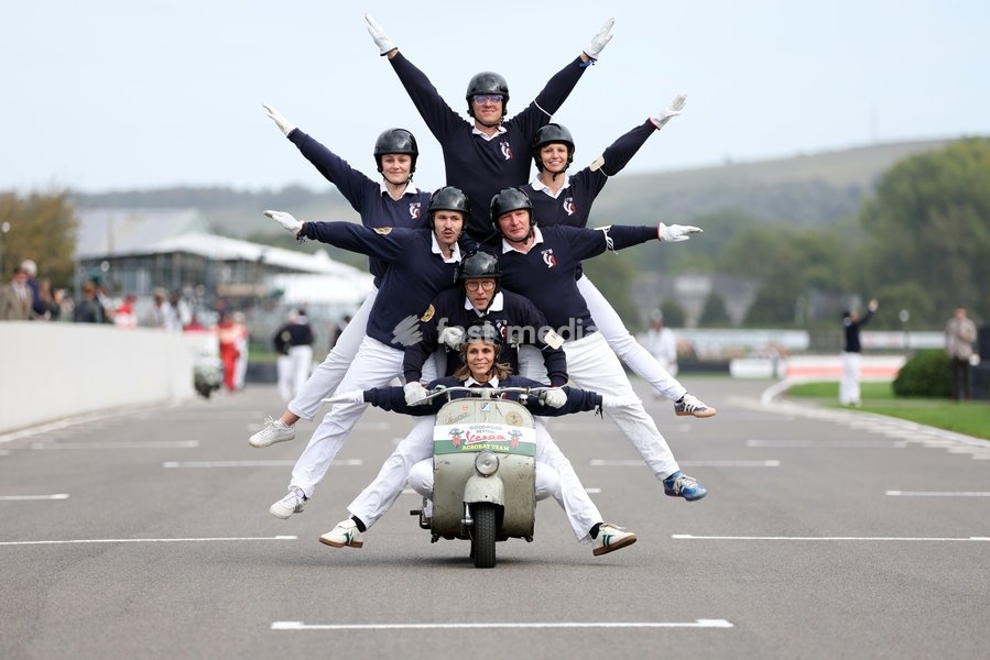 A display team perform during the Vespa track opening parade on day one of Goodwood Revival presented by Dunlop at the Goodwood Motor Circuit in Chichester, West Sussex. Picture date: Friday September 18, 2026. This year's Revival is bringing La Dolce Vita to life with a track parade of over 300…
