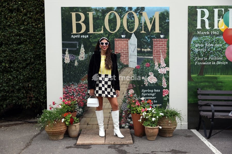 A racegoers in vintage fashion on day two of Goodwood Revival presented by Dunlop at the Goodwood Motor Circuit in Chichester, West Sussex. Picture date: Saturday September 19, 2026. This year's Revival is bringing La Dolce Vita to life with a track parade of over 300 Vespas and vintage scooters, a…