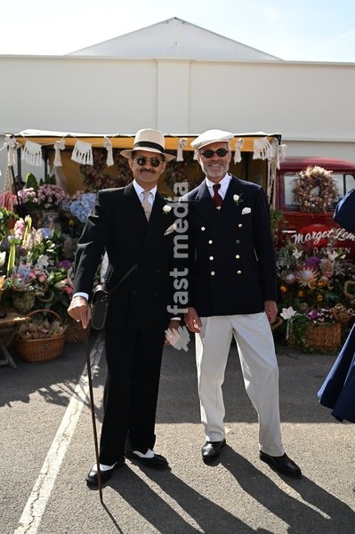 Racegoers in vintage fashion on day one of Goodwood Revival presented by Dunlop at the Goodwood Motor Circuit in Chichester, West Sussex. Picture date: Friday September 18, 2026. This year's Revival is bringing La Dolce Vita to life with a track parade of over 300 Vespas and vintage scooters, a…
