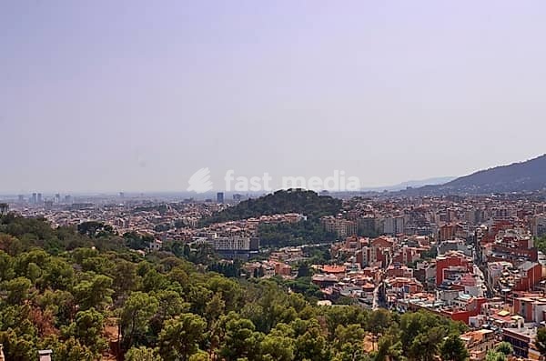 Aerial view of beautiful city Barcelona in sunny summer weather