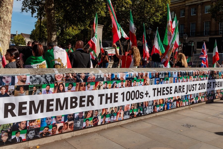 Richmond Terrace, London, UK. 20th Sept 2026. The Iranian diaspora and allies gather opposite Downing Street ahead of a powerful march to mark the fourth anniversary of the state kiling of Mahsa Amini, and to call for a regime change in Iran. A huge banner was stretched along a wall facing…