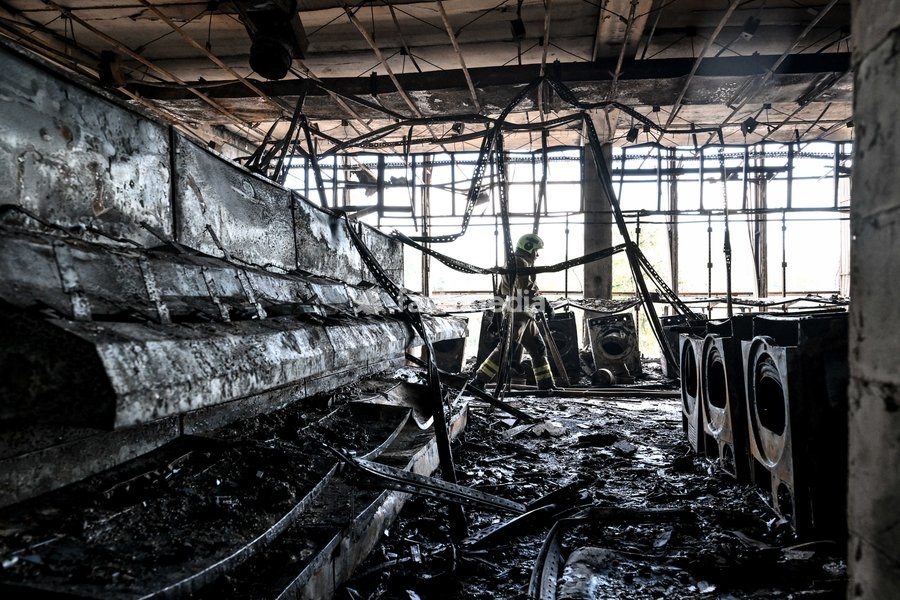 A State Emergency Service rescuer searches for hotspots during a response effort in the Intrade shopping centre, which burned down following a Russian drone attack, Zaporizhzhia, Ukraine, September 21, 2026. Overnight, Russian forces struck the city with strike UAVs and an FPV drone. The attack…
