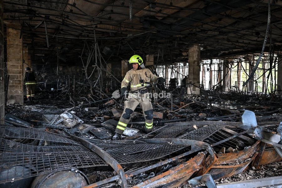 A State Emergency Service rescuer searches for hotspots during a response effort in the Intrade shopping centre, which burned down following a Russian drone attack, Zaporizhzhia, Ukraine, September 21, 2026. Overnight, Russian forces struck the city with strike UAVs and an FPV drone. The attack…