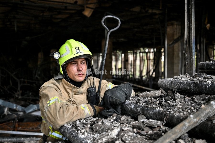 A State Emergency Service rescuer searches for hotspots during a response effort in the Intrade shopping centre, which burned down following a Russian drone attack, Zaporizhzhia, Ukraine, September 21, 2026. Overnight, Russian forces struck the city with strike UAVs and an FPV drone. The attack…