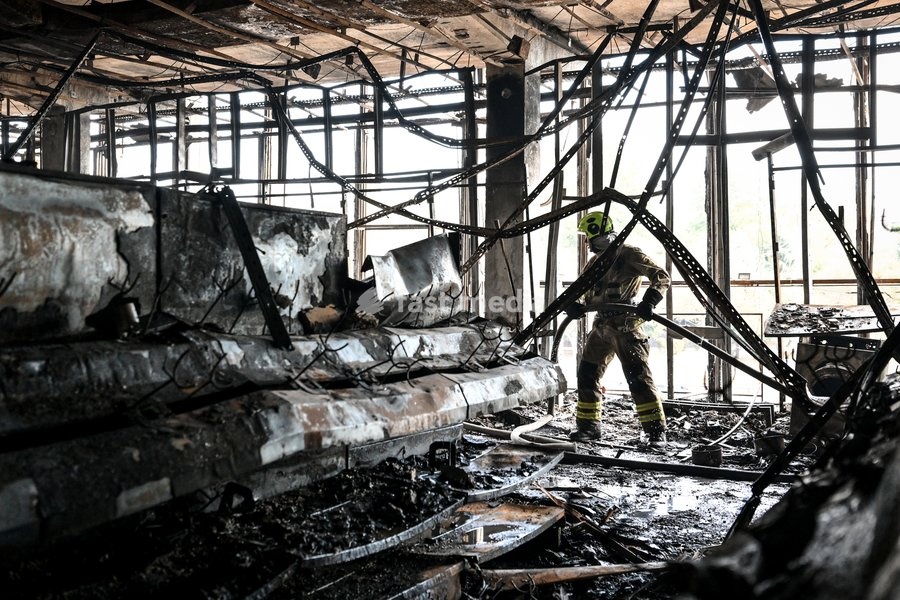 A State Emergency Service rescuer searches for hotspots during a response effort in the Intrade shopping centre, which burned down following a Russian drone attack, Zaporizhzhia, Ukraine, September 21, 2026. Overnight, Russian forces struck the city with strike UAVs and an FPV drone. The attack…