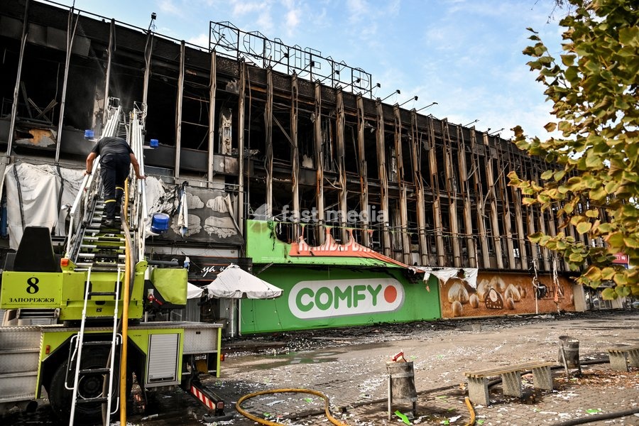 A rescuer climbs a fire ladder to the second-floor window of the Intrade shopping centre, which burned down following a Russian drone attack, during a response effort in Zaporizhzhia, Ukraine, September 21, 2026. Overnight, Russian forces struck the city with strike UAVs and an FPV drone. The…