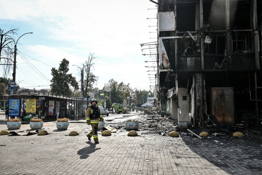 A State Emergency Service rescuer walks past the fire-stricken Intrade shopping centre, which burnt down following a Russian drone attack, Zaporizhzhia, Ukraine, September 21, 2026. Overnight, Russian forces struck the city with strike UAVs and an FPV drone. The attack destroyed a shopping centre,…