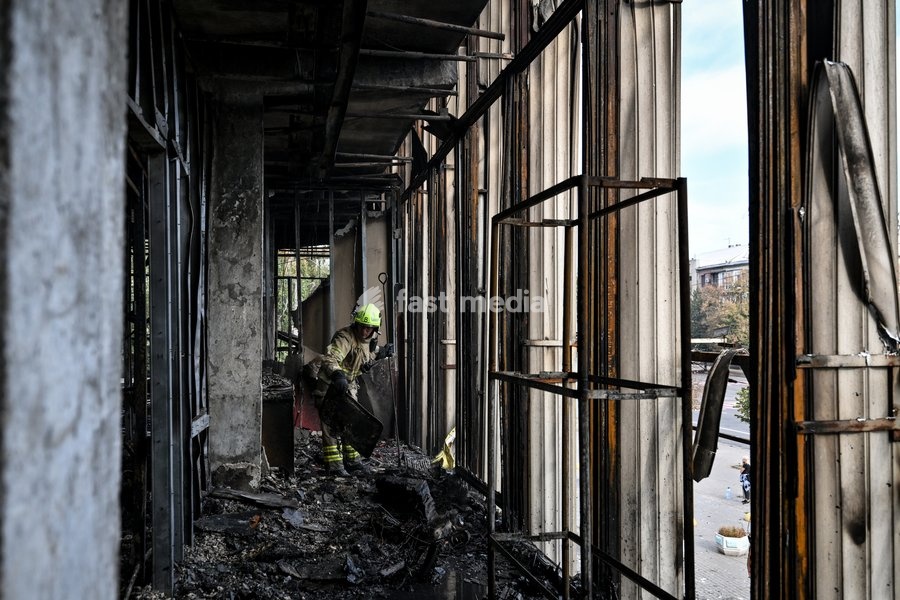 A State Emergency Service rescuer searches for hotspots during a response effort in the Intrade shopping centre, which burned down following a Russian drone attack, Zaporizhzhia, Ukraine, September 21, 2026. Overnight, Russian forces struck the city with strike UAVs and an FPV drone. The attack…