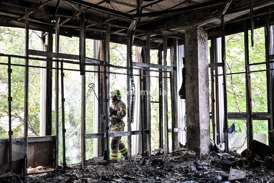 A State Emergency Service rescuer searches for hotspots during a response effort in the Intrade shopping centre, which burned down following a Russian drone attack, Zaporizhzhia, Ukraine, September 21, 2026. Overnight, Russian forces struck the city with strike UAVs and an FPV drone. The attack…