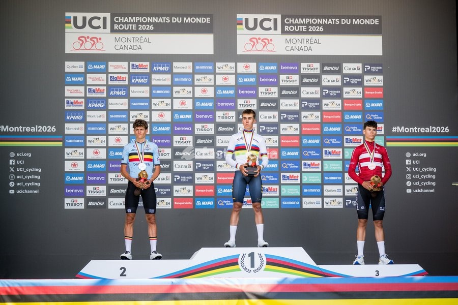 L-R, silver medalist Belgian Vic De Smet, winner with his gold medal Spain's Benjamin Noval and bronze medalist Denmark's Malthe Risbjerg celebrate on the podium of the men's Junior individual time trial race (20,03 km) at the cycling UCI Road World Championship, in Montreal, Canada, Tuesday 22…