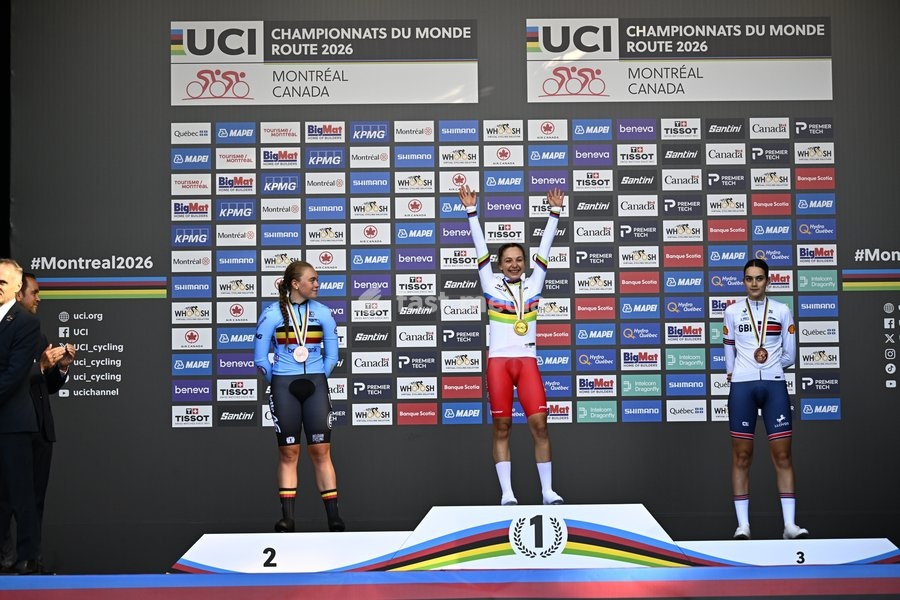 L-R, silver medalist Belgian Yana Decruyenaere; winner world champion Poland's Maria Okrucinska and bronze medalist Great-Britain's Aalia Clay celebrate on the podium of the women's Junior individual time trial race (10,07 km) at the cycling UCI Road World Championship, in Montreal, Canada, Tuesday…