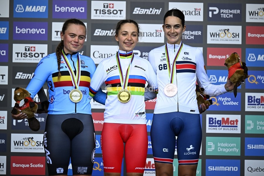 L-R, silver medalist Belgian Yana Decruyenaere; winner world champion Poland's Maria Okrucinska and bronze medalist Great-Britain's Aalia Clay celebrate on the podium of the women's Junior individual time trial race (10,07 km) at the cycling UCI Road World Championship, in Montreal, Canada, Tuesday…