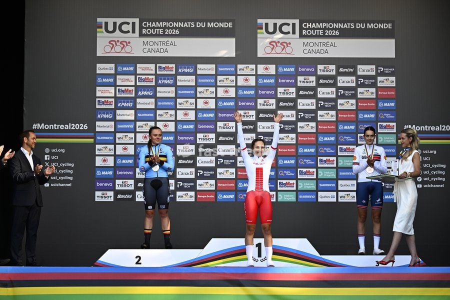 L-R, silver medalist Belgian Yana Decruyenaere; winner world champion Poland's Maria Okrucinska and bronze medalist Great-Britain's Aalia Clay celebrate on the podium of the women's Junior individual time trial race (10,07 km) at the cycling UCI Road World Championship, in Montreal, Canada, Tuesday…